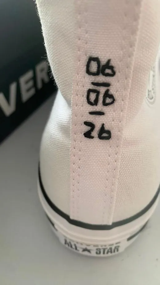 A special date hand-embroidered onto canvas trainers