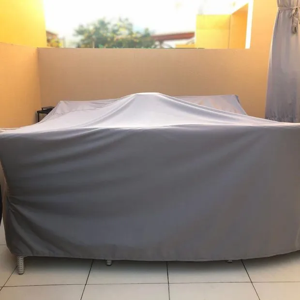 Custom grey cover protecting outdoor furniture on a Jávea terrace