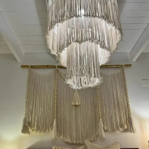 Large handmade macramé wall hanging with tiered fringing