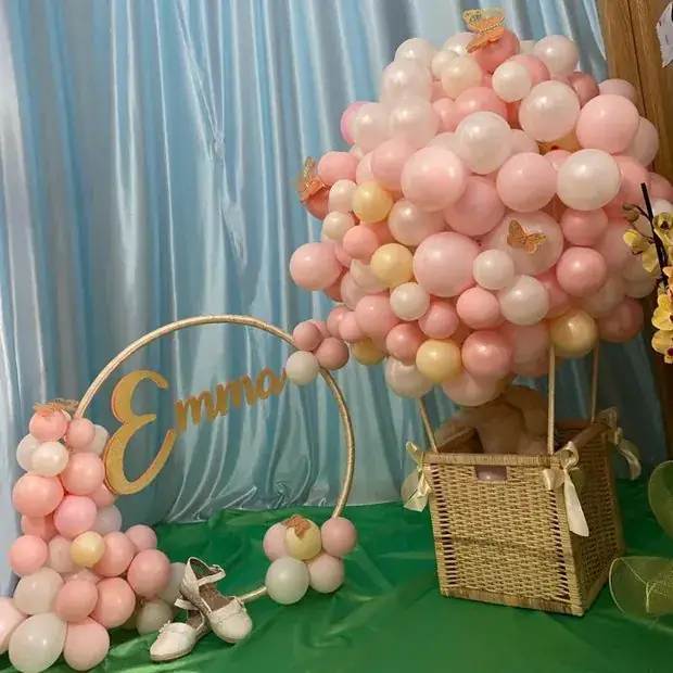 Pink balloon arrangement centrepiece with a personalised name hoop