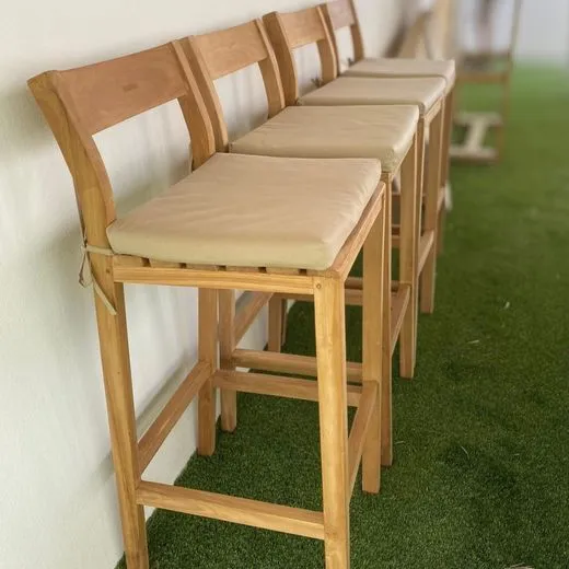 Teak bar stools with made-to-measure seat pads