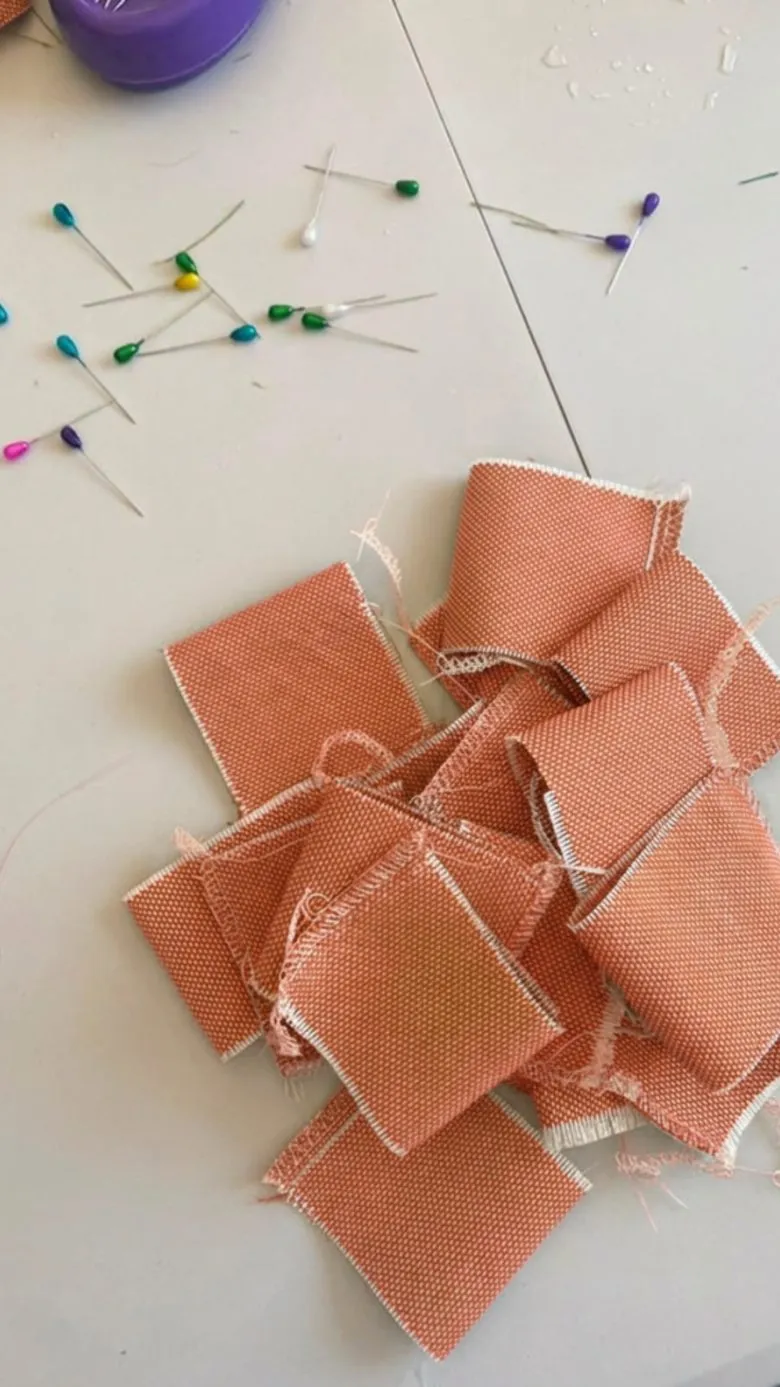 Terracotta cover fabric cut and pinned, ready to sew, in Cindy's Beniarbeig workshop
